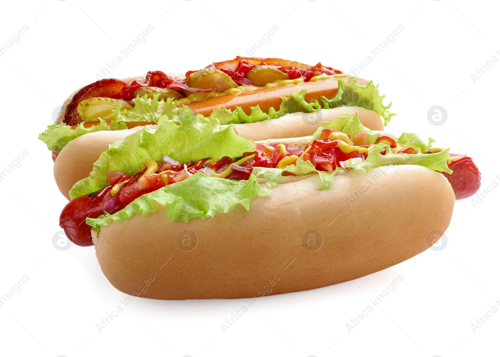 Photo of Tasty hot dogs with different toppings isolated on white