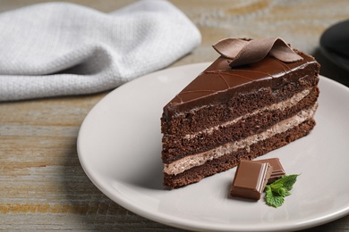 Delicious fresh chocolate cake served on wooden table