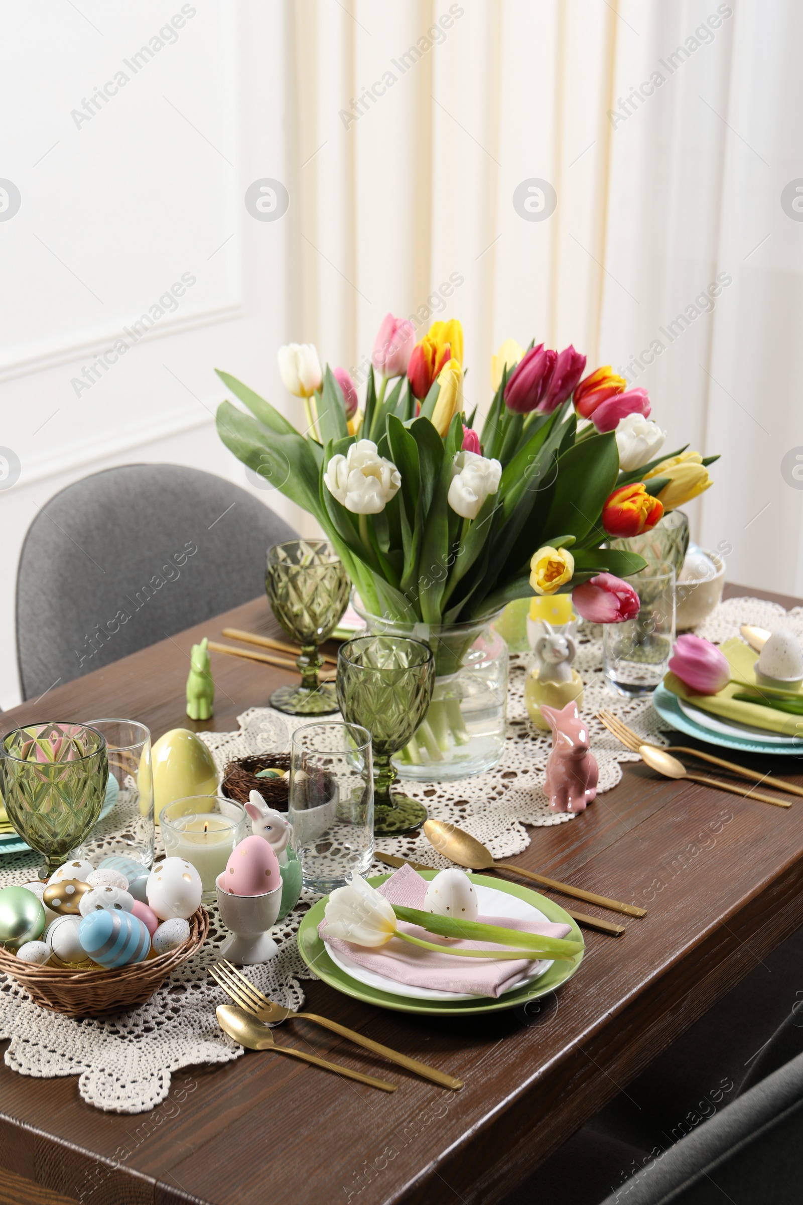 Photo of Festive table setting with beautiful flowers. Easter celebration