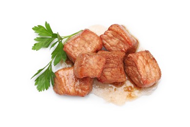 Photo of Pieces of delicious cooked beef and parsley isolated on white, top view. Tasty goulash