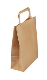Photo of Kraft shopping paper bag isolated on white
