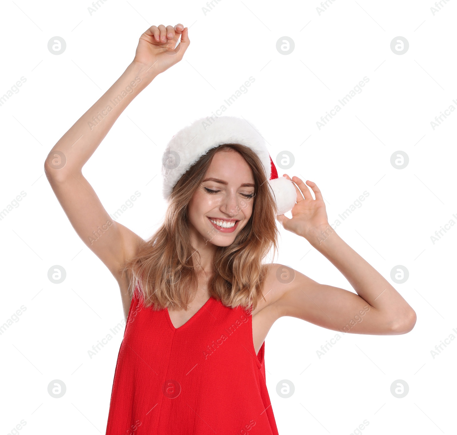 Photo of Happy young woman in Santa hat on white background. Christmas celebration