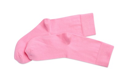 Pair of pink socks on white background, top view