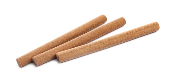 Photo of Many aromatic incense sticks on white background