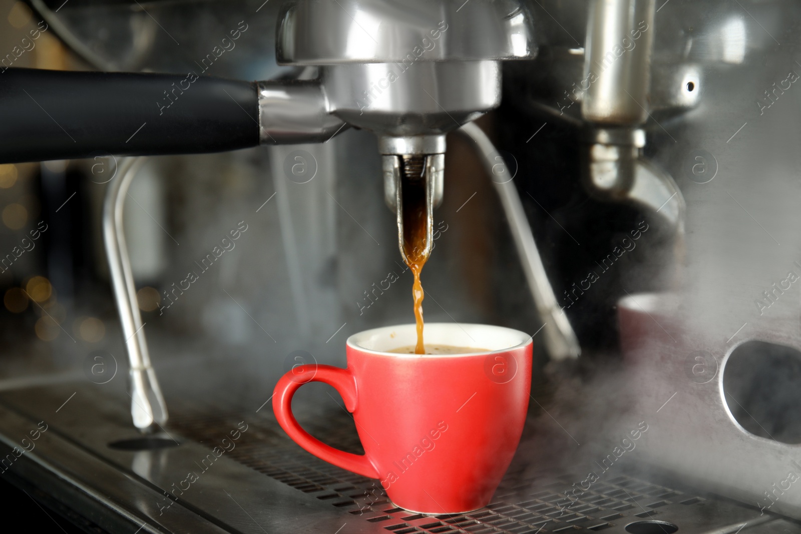 Photo of Making fresh aromatic espresso using professional coffee machine