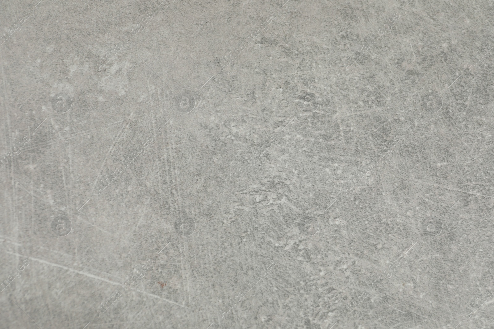 Photo of Texture of light grey stone surface as background, closeup