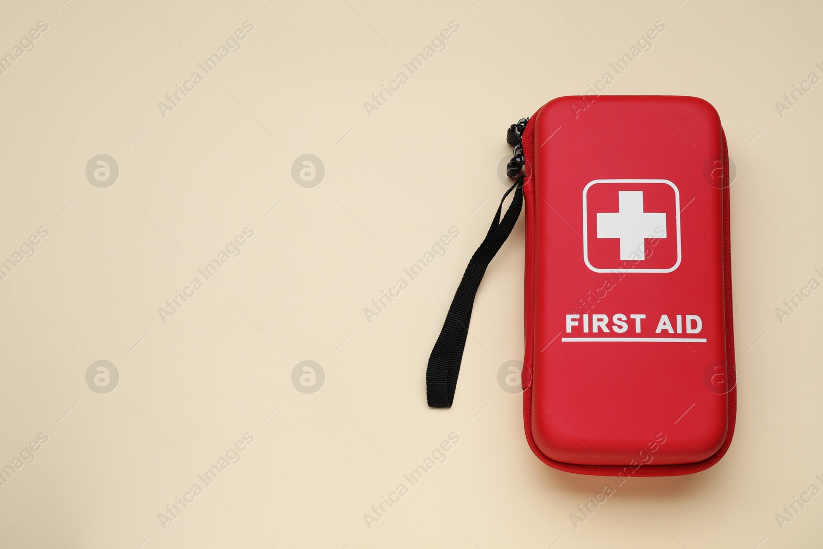 Photo of Medicine bag on beige background, top view with space for text. First aid kit