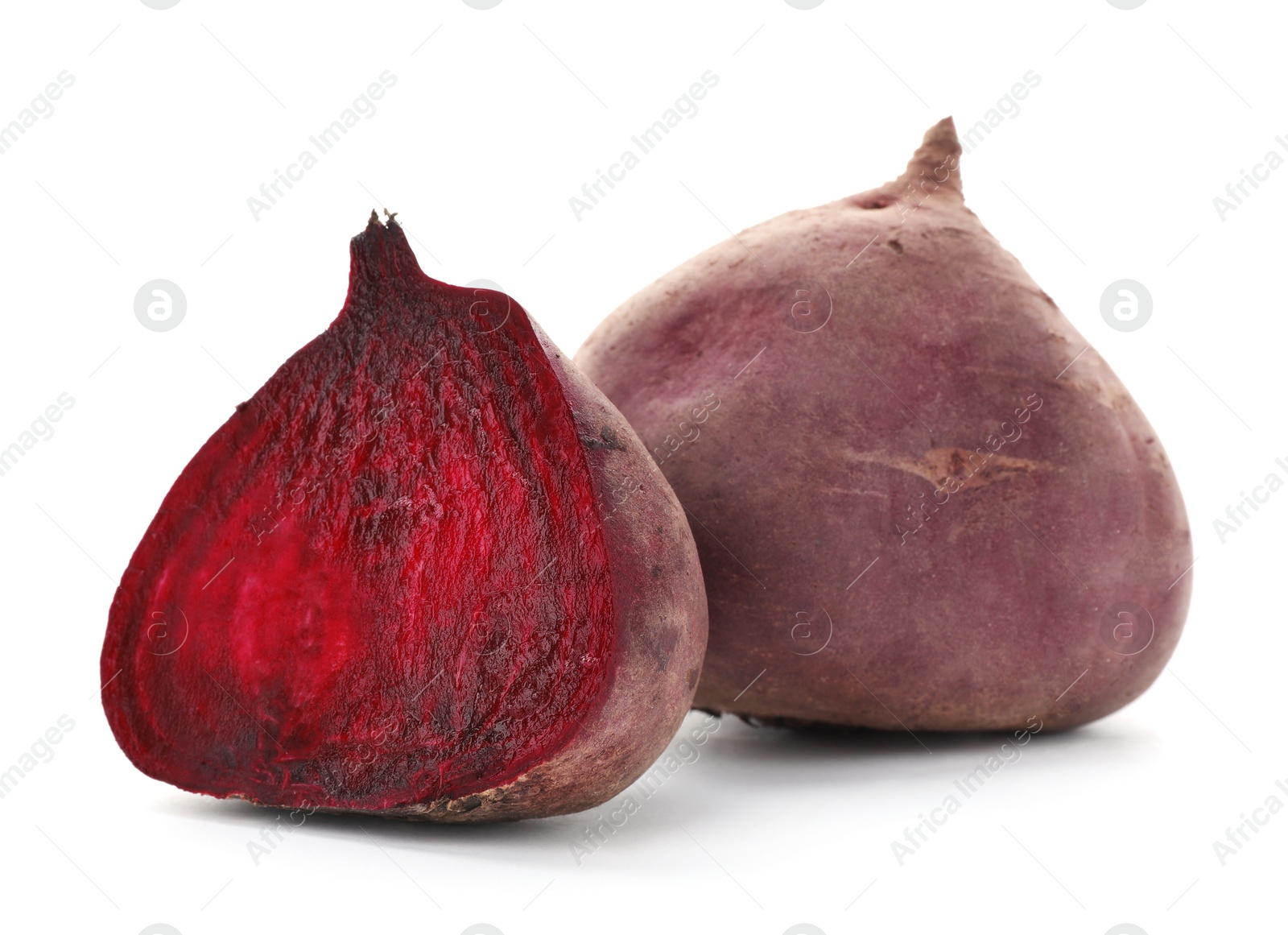 Photo of Cut and whole beets on white background. Taproot vegetable