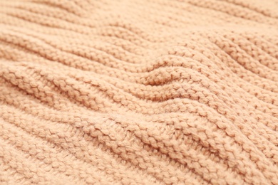 Texture of cozy warm sweater as background, closeup