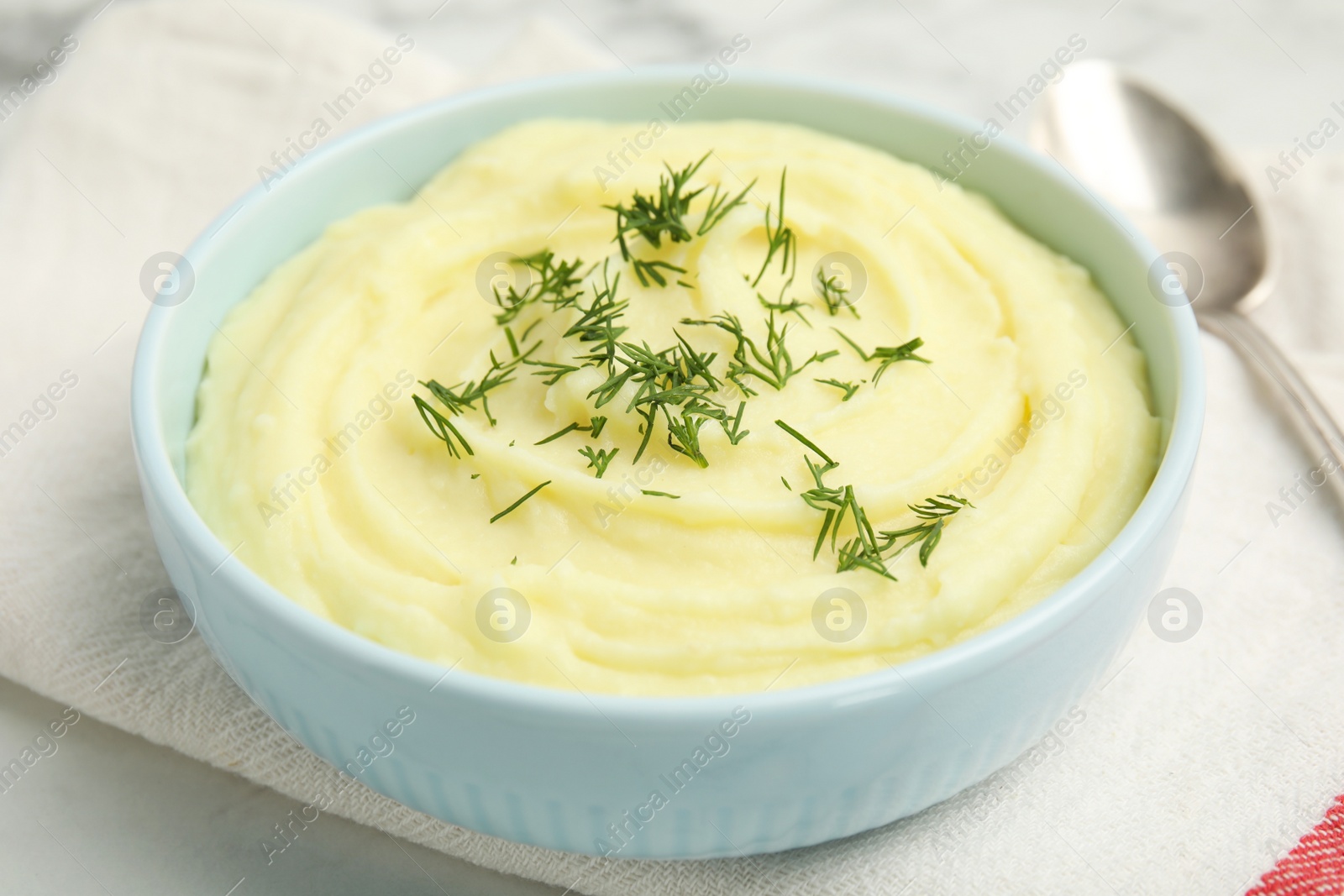 Photo of Freshly cooked homemade mashed potatoes on white table, closeup