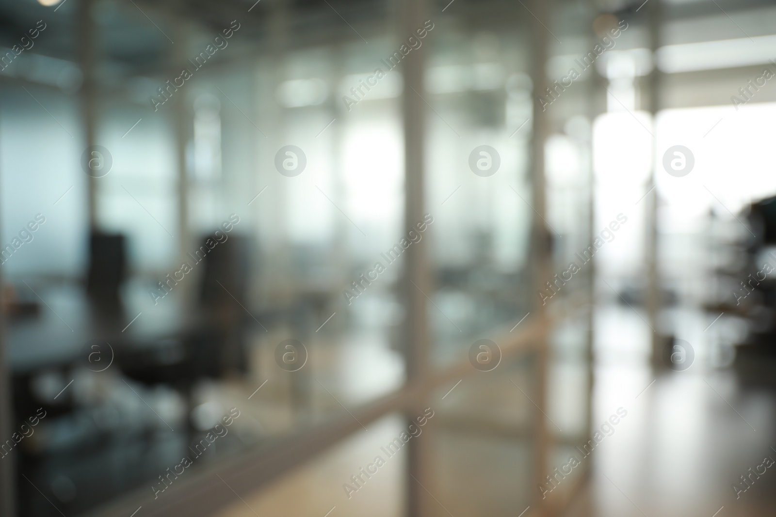 Photo of Blurred view of cozy workspaces with tables and chairs in office