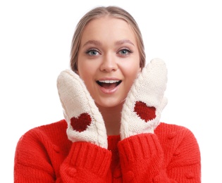 Emotional young woman in warm sweater and mittens on white background. Winter season
