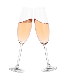 Toasting with glasses of rose champagne on white background