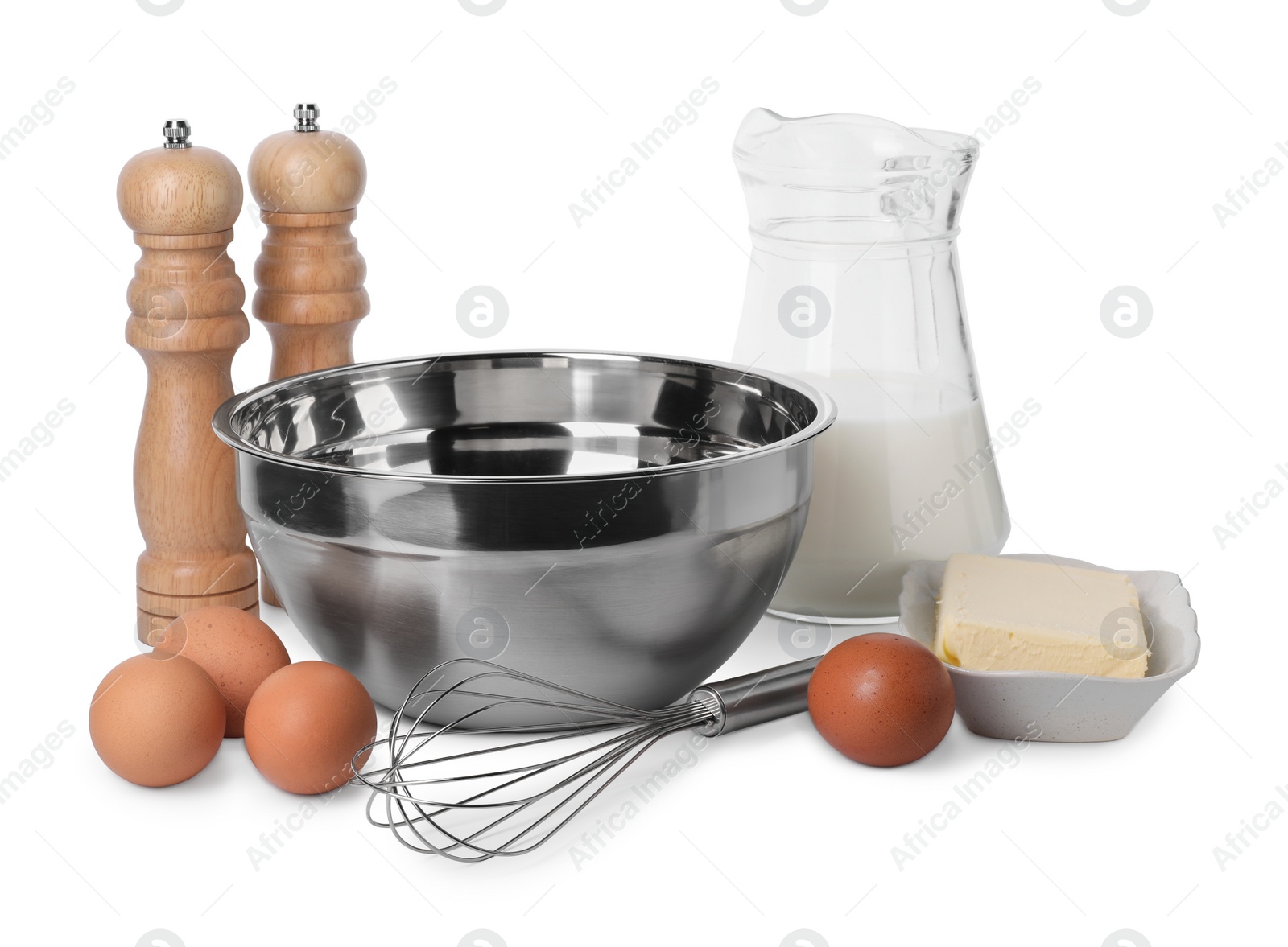 Photo of Metal whisk and dough ingredients isolated on white