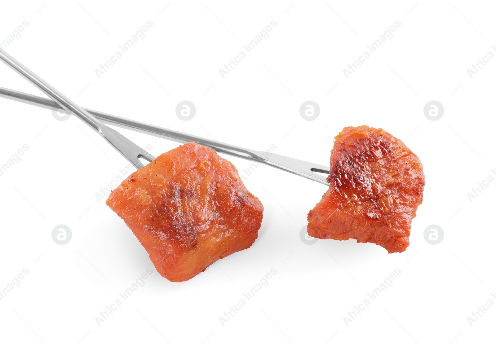 Photo of Fondue forks with pieces of fried meat isolated on white