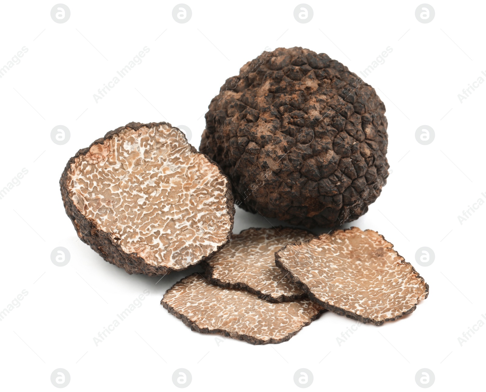 Photo of Cut and whole black truffles isolated on white