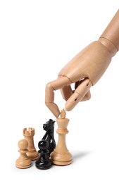 Photo of Robot touching king near chess pieces isolated on white. Wooden hand representing artificial intelligence