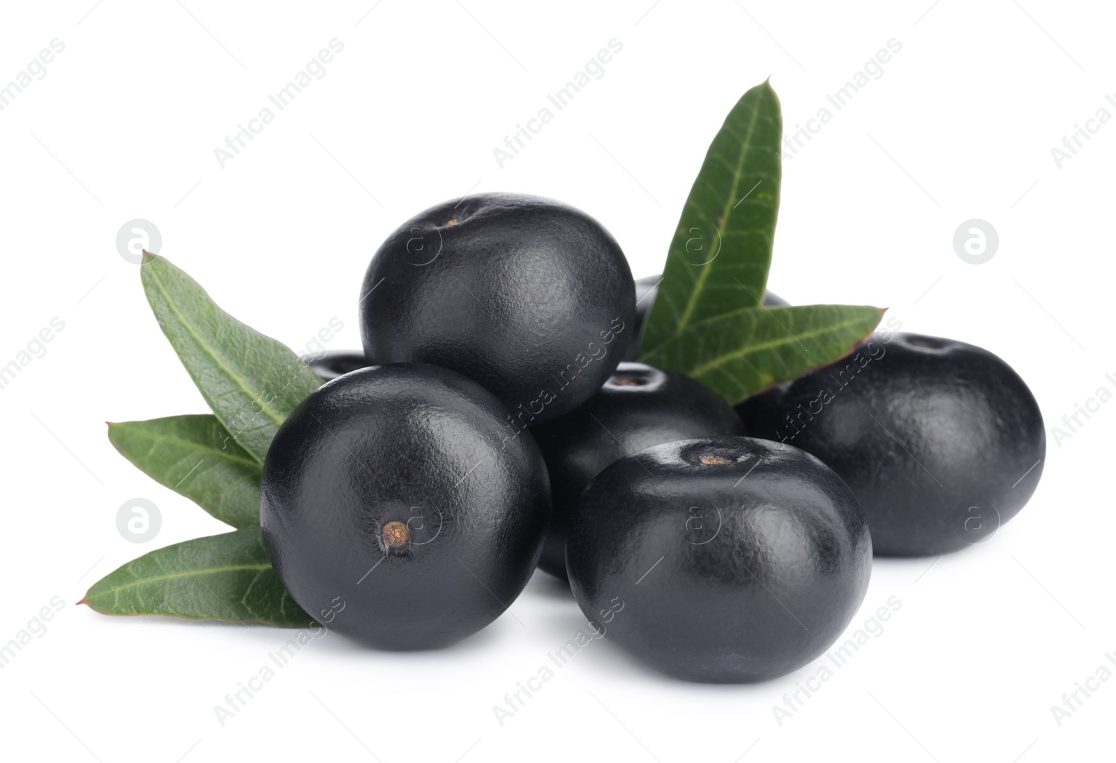 Photo of Pile of fresh ripe acai berries and green leaves on white background