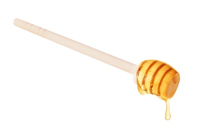 Photo of Natural honey dripping from dipper on white background