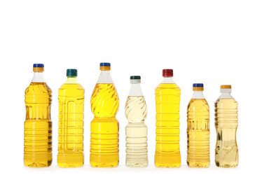 Cooking oil in different bottles isolated on white