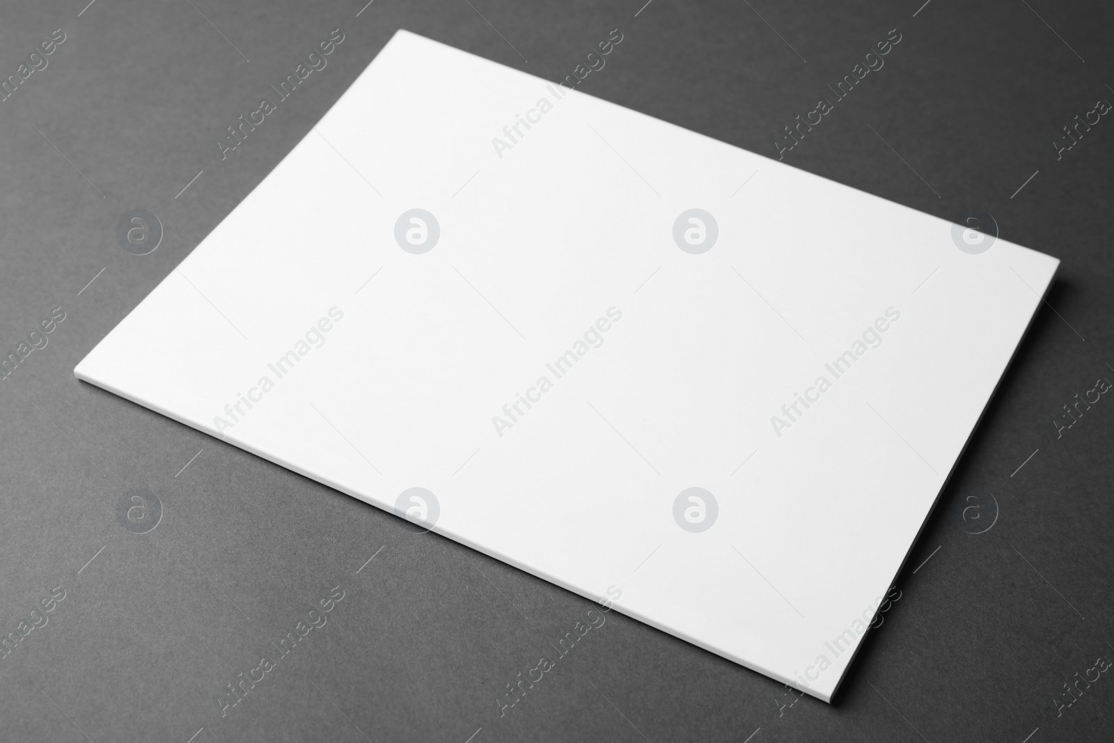 Photo of Blank book on dark grey background. Mock up for design