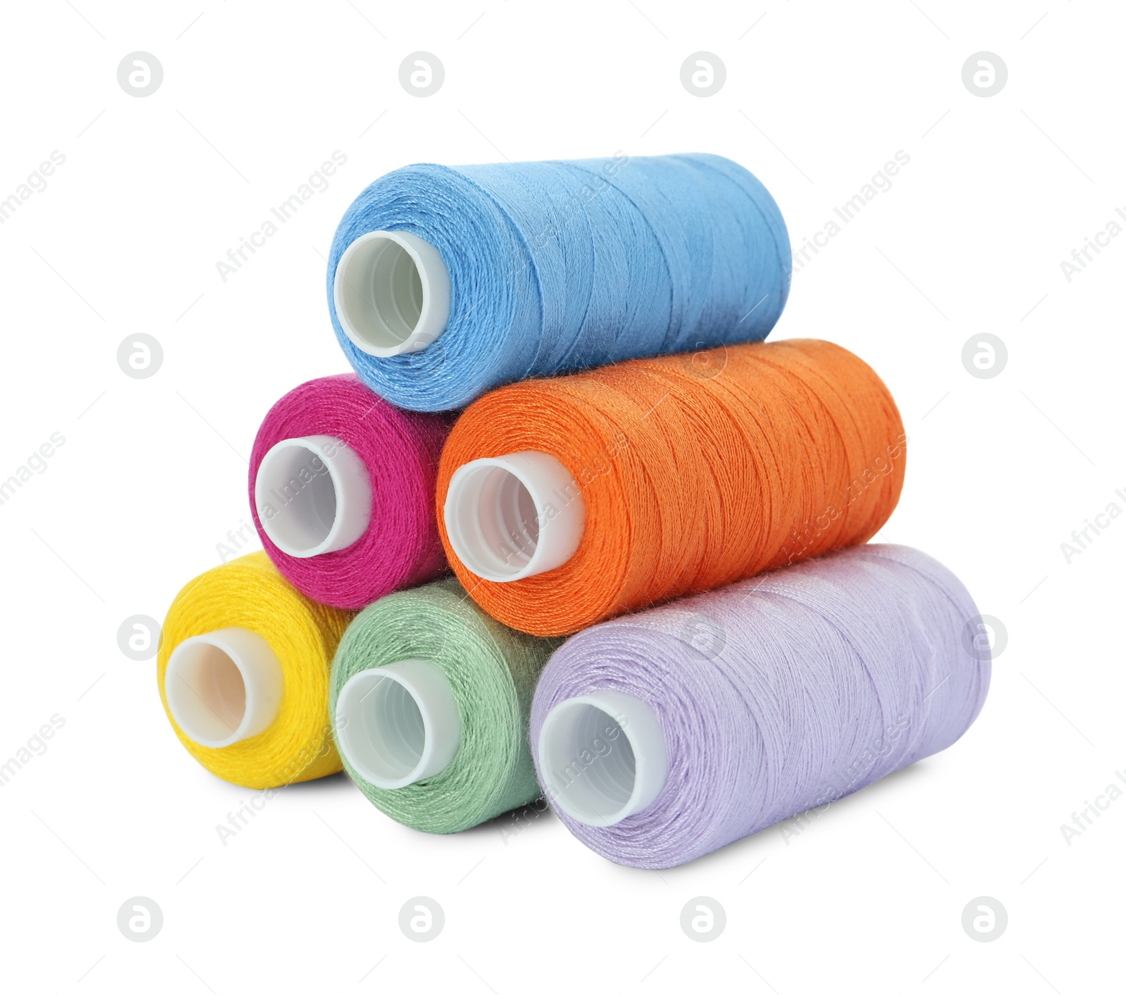 Photo of Different colorful sewing threads on white background