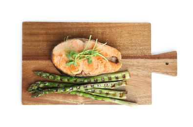 Tasty salmon steak with asparagus and sprouts isolated on white, top view