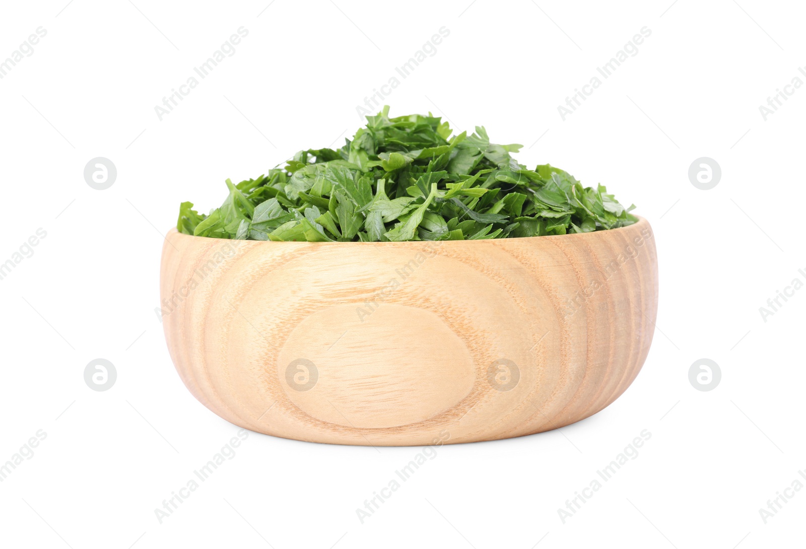 Chopped parsley leaves in wooden bowl isolated on white Photo of Chopped parsley leaves in wooden bowl isolated on white