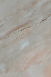 Photo of Texture of beige marble surface as background, closeup