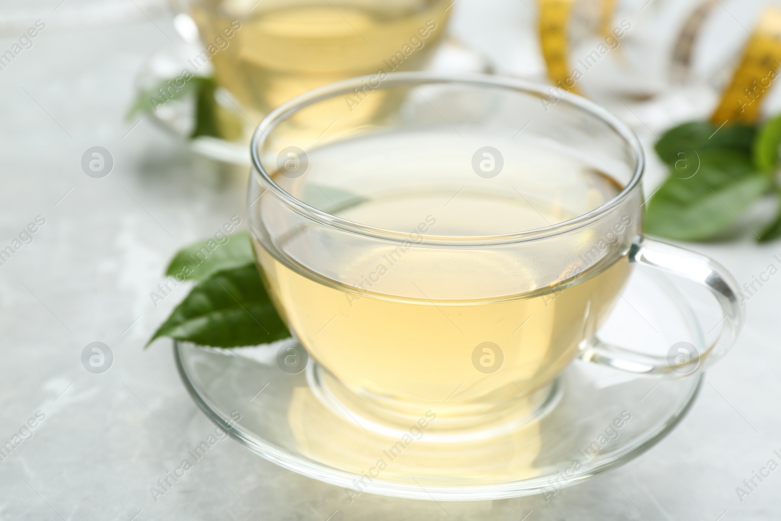 Photo of Herbal diet tea on light table, closeup