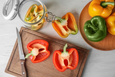 Raw ripe paprika peppers on table, top view