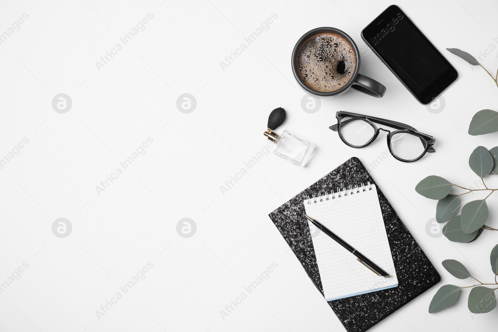 Photo of Notebooks, mobile phone and blogger's stuff on white background, top view