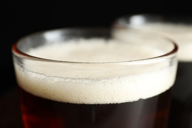 Glass of delicious kvass on dark background, closeup