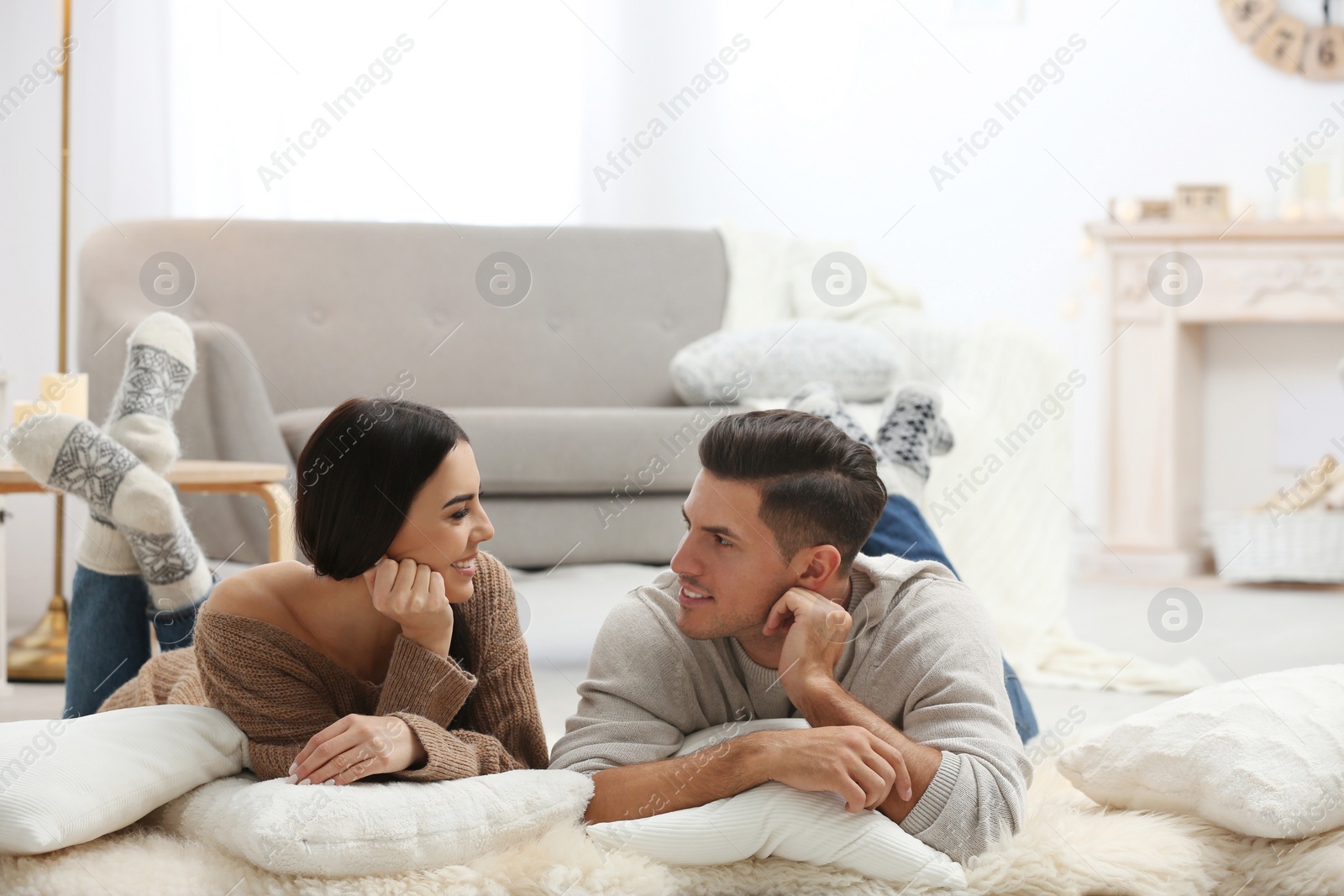 Photo of Happy couple spending time together at home. Winter vacation