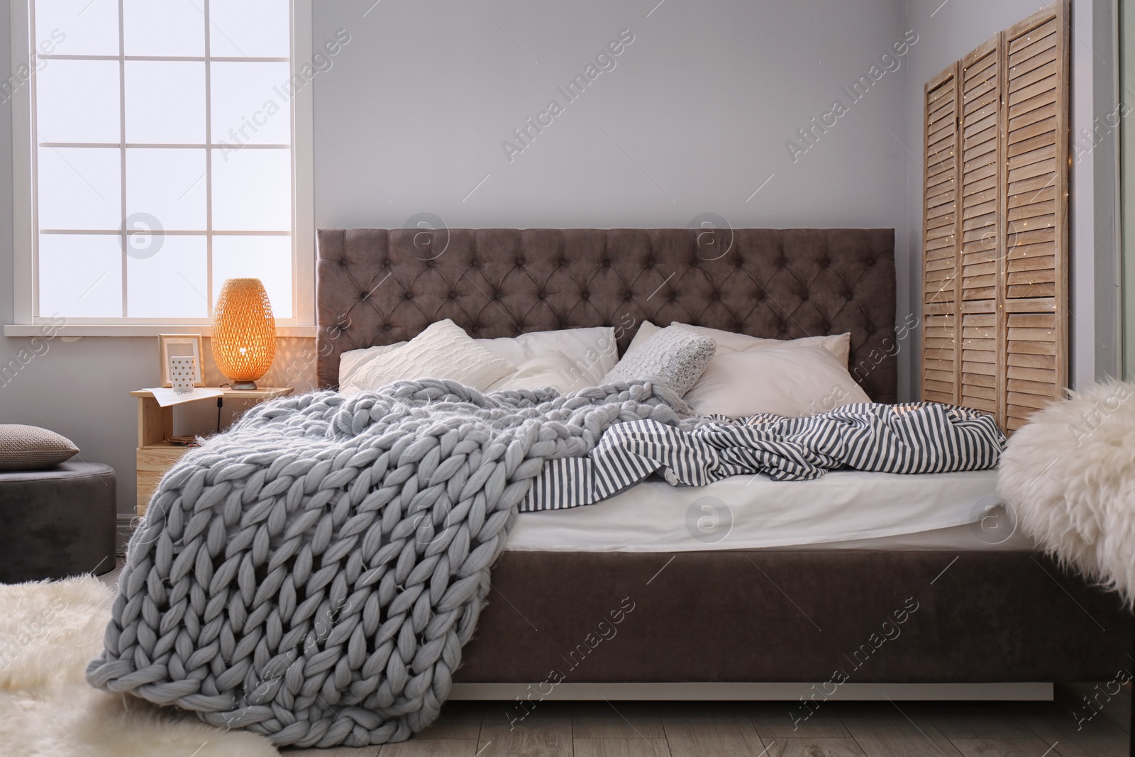 Photo of Stylish bedroom interior with comfortable bed