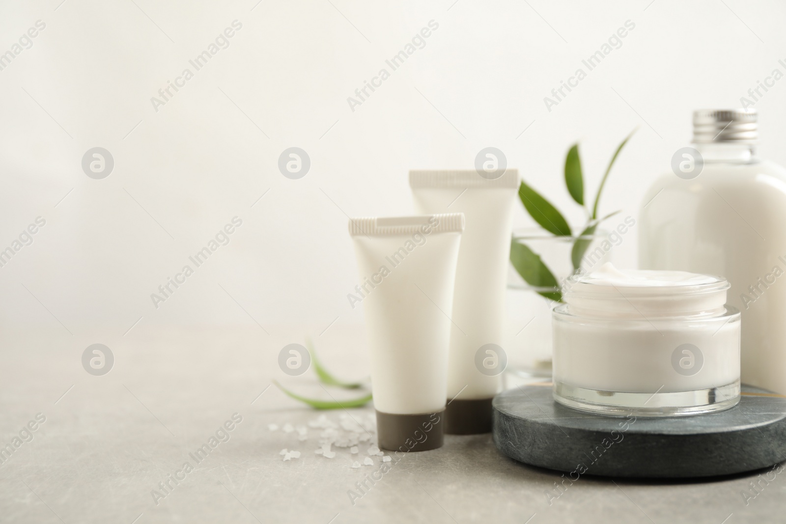 Photo of Composition with skin care products on light background, space for text