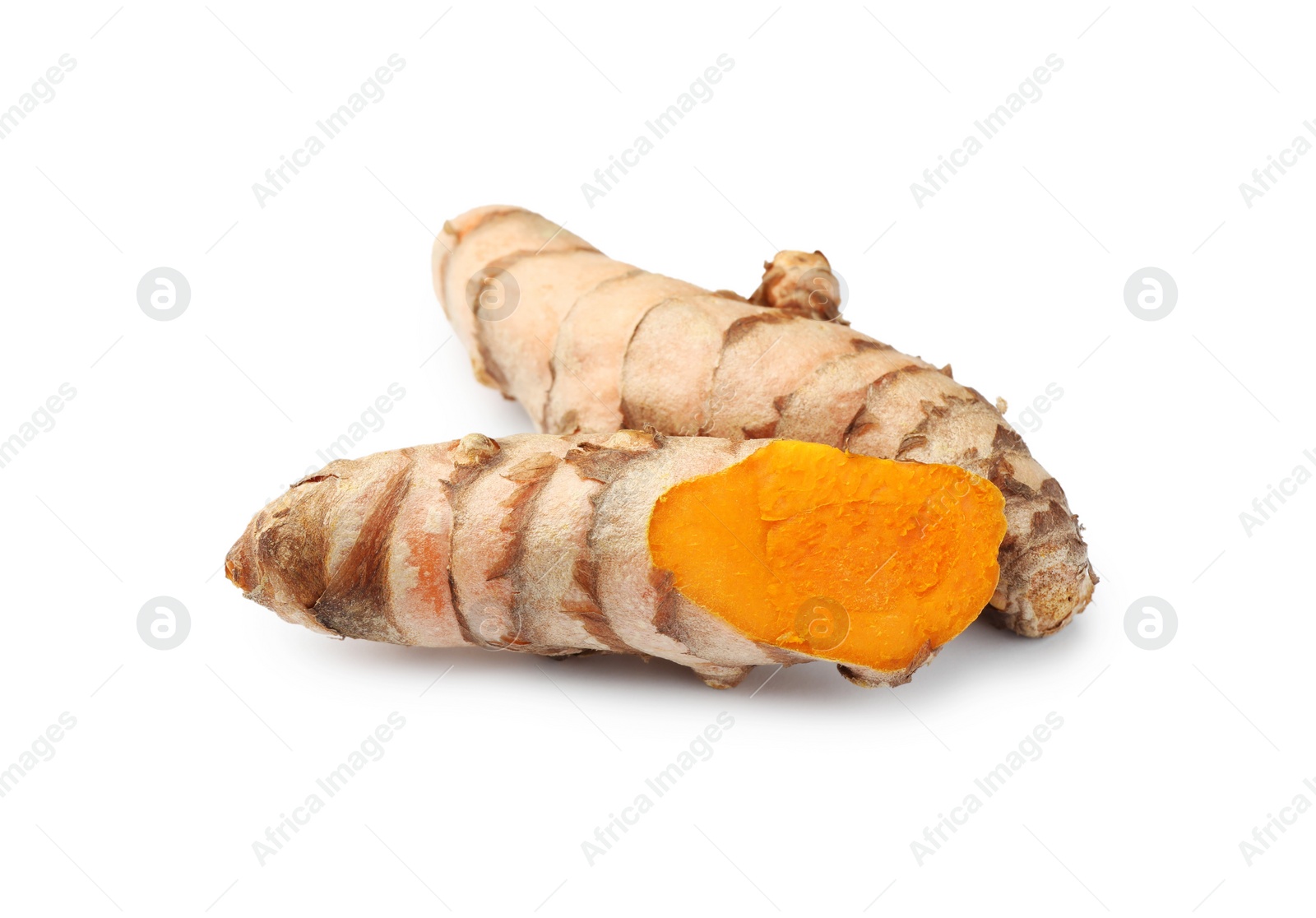 Photo of Fresh whole and cut turmeric roots isolated on white