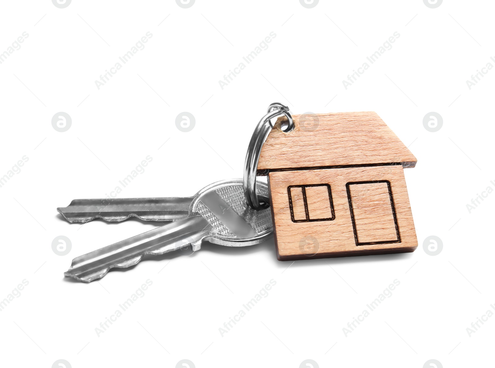 Photo of House keys with trinket on white background