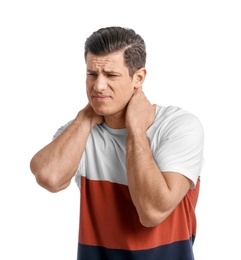 Young man suffering from neck pain on white background