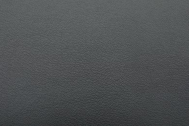 Texture of dark grey leather as background, closeup