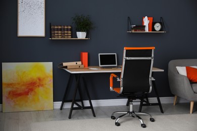 Photo of Modern workplace with comfortable chair in stylish home office interior