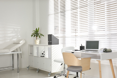 Photo of Doctor's office interior with modern workplace in clinic