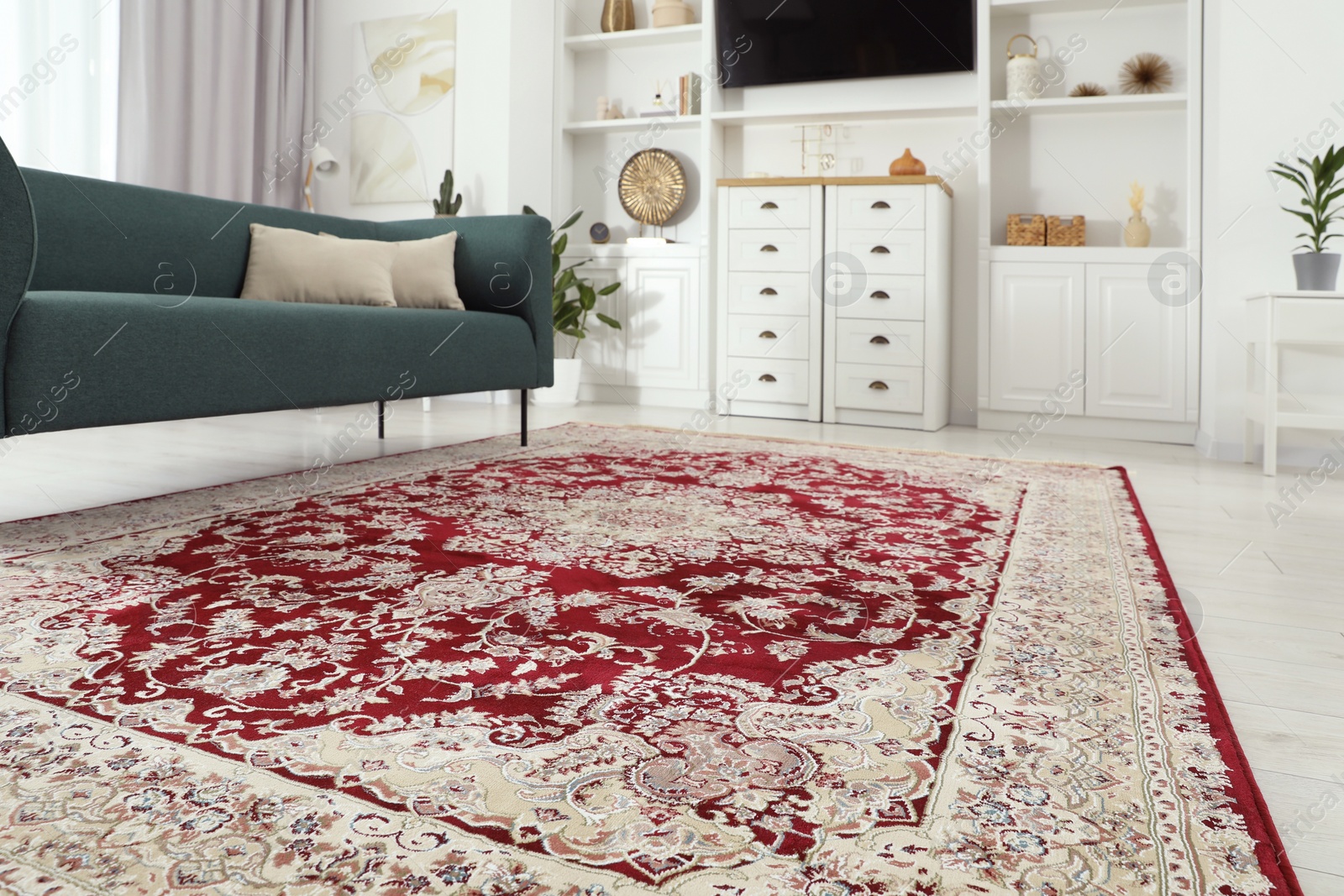 Photo of Stylish living room with beautiful carpet and furniture, closeup. Interior design