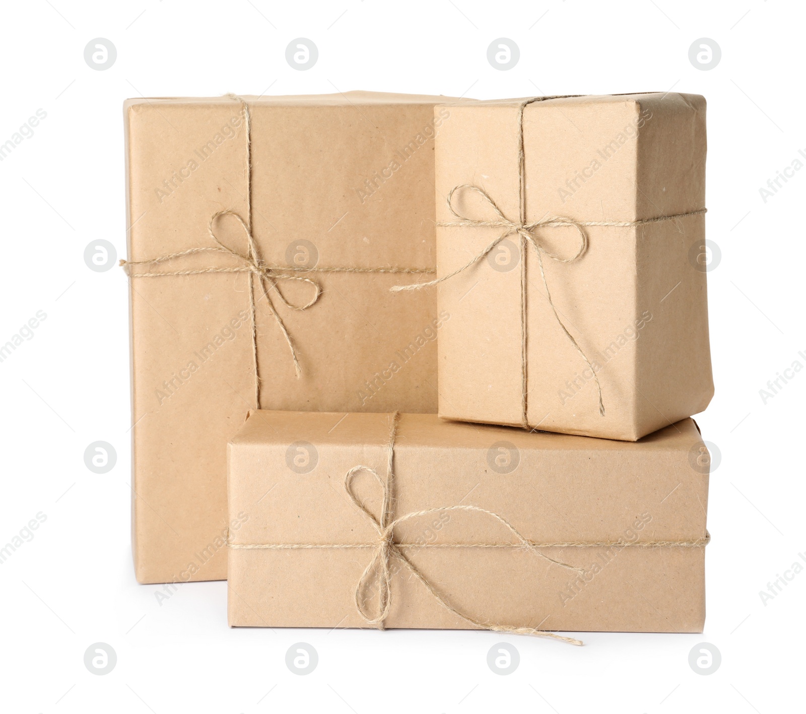 Photo of Parcels wrapped with kraft paper and twine on white background