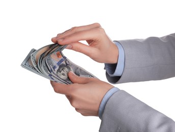 Money exchange. Woman counting dollar banknotes on white background, closeup