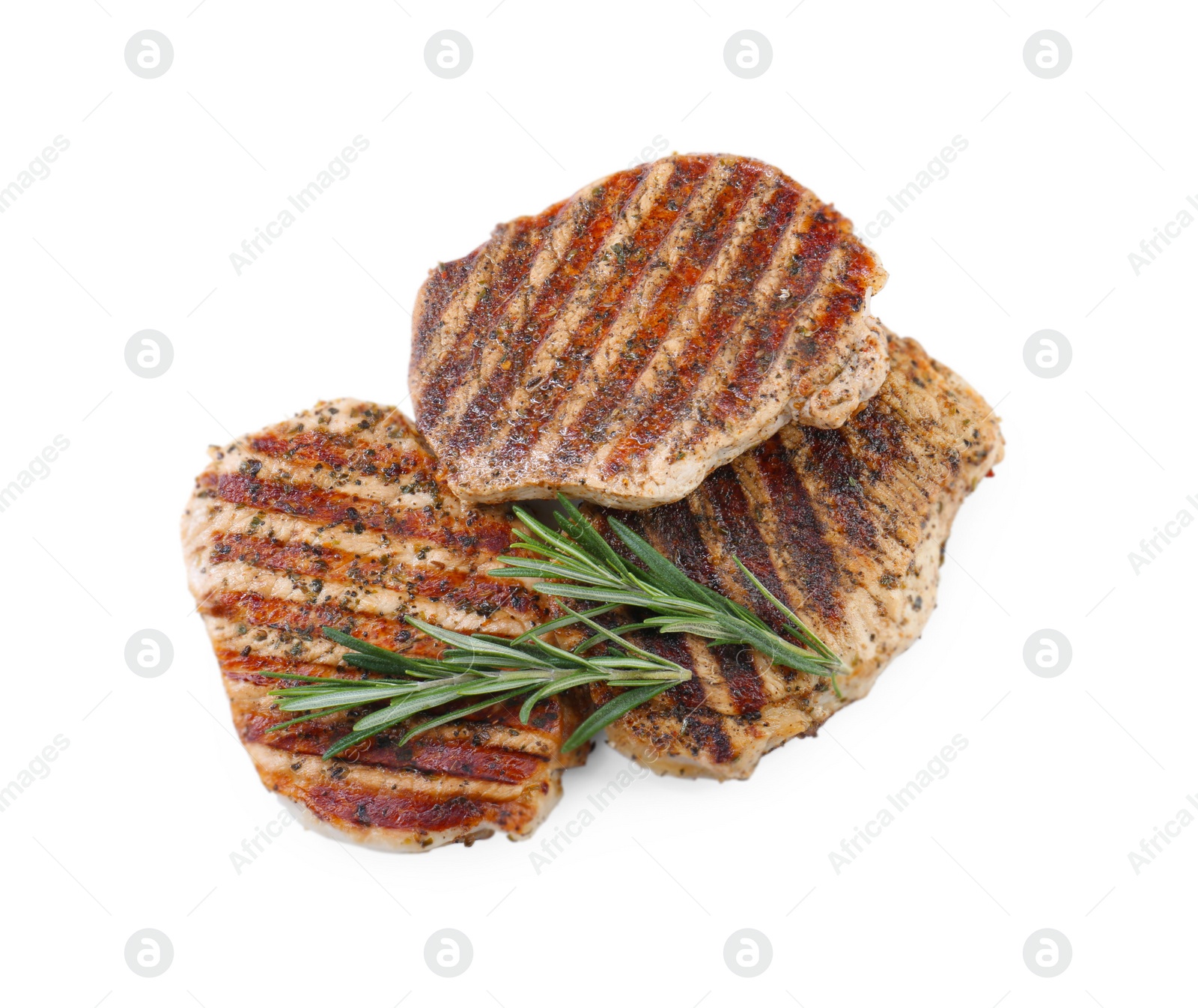 Photo of Delicious grilled pork steaks and rosemary on white background, top view