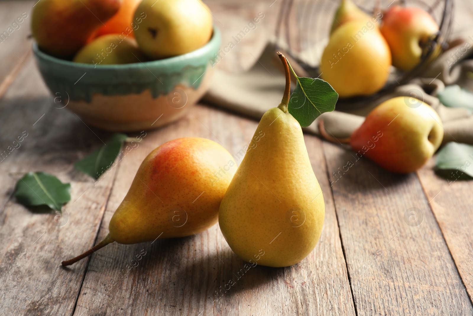 Photo of Ripe pears on wooden table. Healthy snack