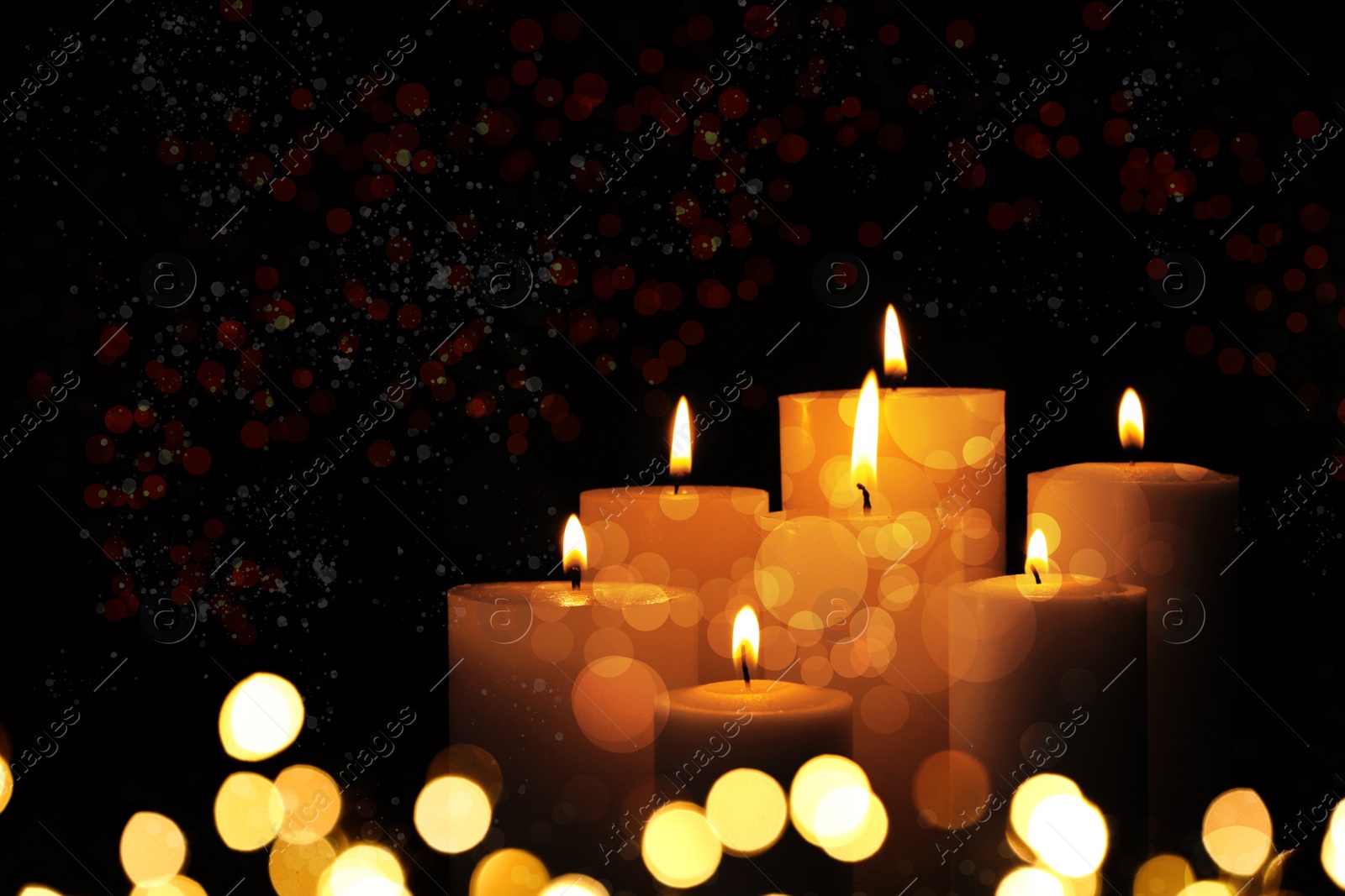 Image of Burning candles on dark background, bokeh effect