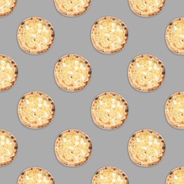 Image of Many delicious cheese pizzas on light grey background, flat lay. Seamless pattern design