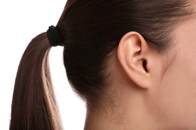 Woman on white background, closeup of ear